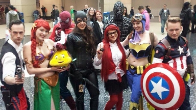 Mya at C2E2 2015, cosplaying as Grell Sutcliff from Black Butler, with a bunch of superheroes, Princess Ariel with Flounder, & a couple of photobombers